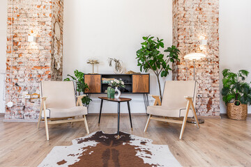 Bright and spacious living area featuring modern furniture and natural light in a stylish apartment in soft warm colors