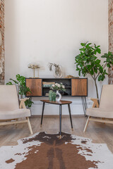 Bright and spacious living area featuring modern furniture and natural light in a stylish apartment in soft warm colors