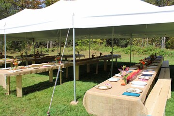  Outdoor Tent Setup with Rustic Tables for Wedding