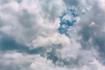 Dynamic sky with fluffy clouds and patches of blue, perfect for desktop backgrounds or website wallpapers