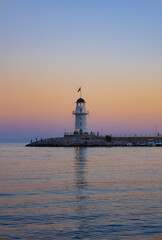 Lighthouse in the port of Alanya. white lighthouse in seaport of Alanya