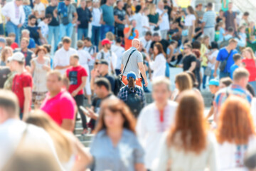Crowd of people with men and women on busy city street