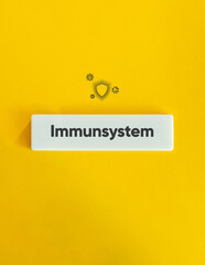 Immune System Banner and Concept Image. Icon and Text on Block Letter Tile on Yellow Background. Minimal Aesthetic.