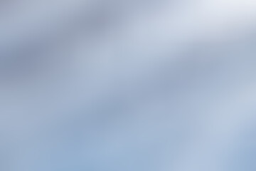 Soft blue background with soft white in the top right corner. Abstract blue wave background for pastel, gradient, silver, blur, cozy, softness, and simple concepts. Smooth wavy blue texture.