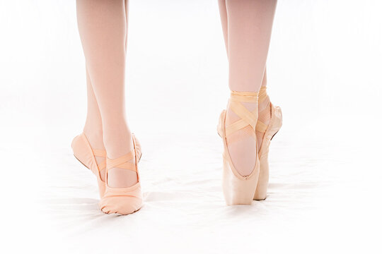 Two Ballerinas En Pointe and Tip Toe with Pink Ballet Shoes and Tights