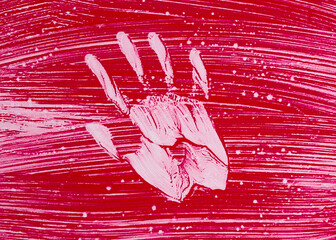 Handprint on red background symbolizing violence and war