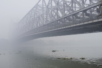 The Majestic Howrah Bridge on a Foggy Morning