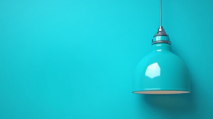 Obraz premium A turquoise pendant lamp hangs against a matching wall, creating a vibrant and modern aesthetic.