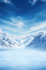 Obraz premium Serene winter landscape with snow-capped mountains and frozen lake