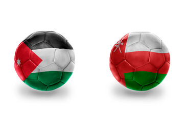 Fototapeta premium football balls with national flags of oman and jordan,soccer teams. on the white background.