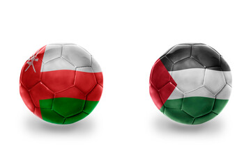 football balls with national flags of palestine and oman ,soccer teams. on the white background.