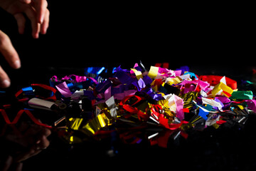 Vibrant confetti on a floor. Pollution and environmental impact of toxic sythetic plastic.