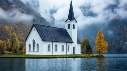 Obraz premium Serene White Church on a Tranquil Lake, Misty Mountains, Colorful Autumn Forest. Peaceful Landscape