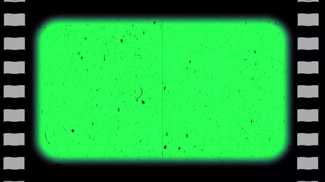 Film frame texture with sprocket hole on green screen with grain, film dirt, dust, hair, leaks and scratches. Old Film reel strip rolling overlay. 4k resolution free video download