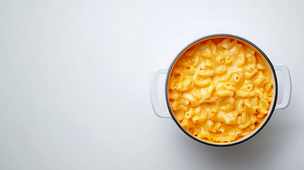 A pot of creamy macaroni and cheese on a plain background.