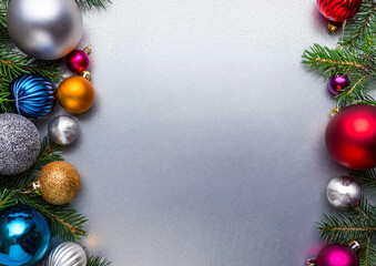 colourful Christmas decorations on a silver background