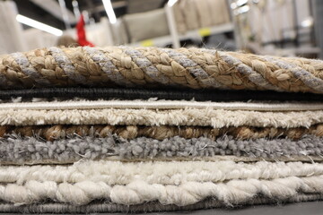 Fototapeta premium Explore the stunning display of textured area rugs showcased at the home decor store today