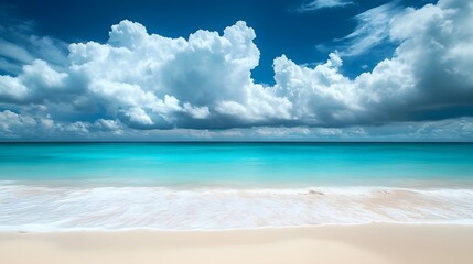 Fototapeta premium Peaceful beach with turquoise waters and soft white sand, set against a sky filled with colorful, dramatic clouds. An idyllic scene of tranquility and natural beauty.