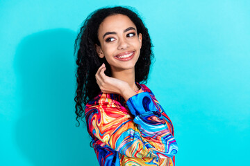 Fototapeta premium Photo of pretty young girl look empty space ad wear pullover isolated on teal color background