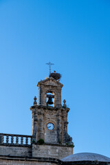 Fototapeta premium Close-up of a Church Tower Featuring a Stork Nest
