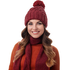 A woman wearing a red hat and scarf is smiling. She has long, curly hair and is wearing a red sweater