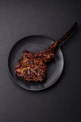 Grilled wagyu beef tomahawk steak with salt, spices and herbs