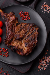 Grilled wagyu beef tomahawk steak with salt, spices and herbs