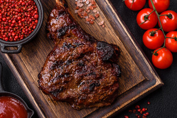 Grilled wagyu beef tomahawk steak with salt, spices and herbs