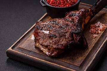 Grilled wagyu beef tomahawk steak with salt, spices and herbs