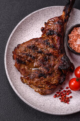 Grilled wagyu beef tomahawk steak with salt, spices and herbs