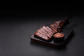 Grilled wagyu beef tomahawk steak with salt, spices and herbs