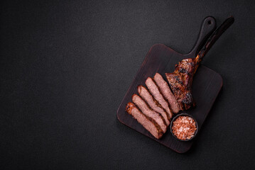 Grilled wagyu beef tomahawk steak with salt, spices and herbs