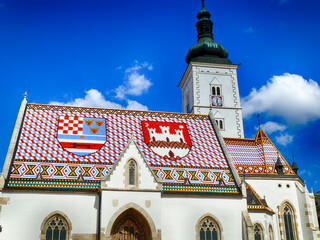 Saint mark's church showing the coat of arms of croatia and zagreb on its roof