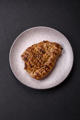 Grilled beef or pork steak with salt, spices and herbs