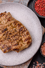 Grilled beef or pork steak with salt, spices and herbs