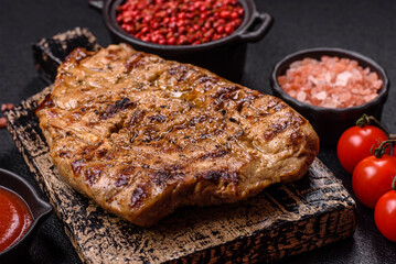 Grilled beef or pork steak with salt, spices and herbs
