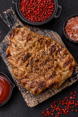 Grilled beef or pork steak with salt, spices and herbs