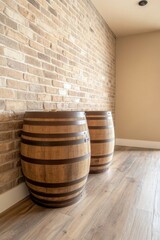Rustic wooden barrels against a brick wall in a cozy interior