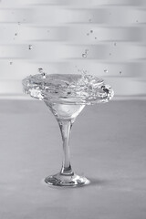 Glass with water up and splash. Healthy lifestyle concept