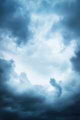 Fototapeta premium Dramatic stormy sky with dark clouds and bright light