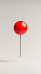 Vibrant red balloon floating against a minimalist background