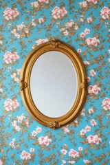 Obraz premium Vintage mirror with ornate gold frame against a floral wallpaper background