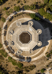 Aerial perpendicular view of Castel del Monte. It is a castle situated on a hill near Andria in the Apulia region, Italy. It is a fortress built in the Middle Ages and famous for its octagonal plan.