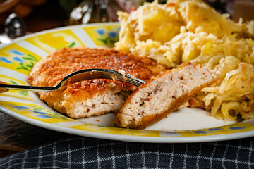 Minced meat cutlet with boiled sauerkraut.