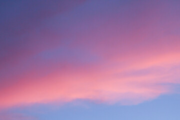 pink clouds in the cool blue sky abstract background