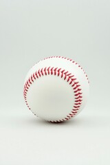 Close-up of a classic white baseball with red stitching