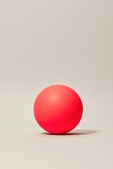 Vibrant red sphere against a neutral background