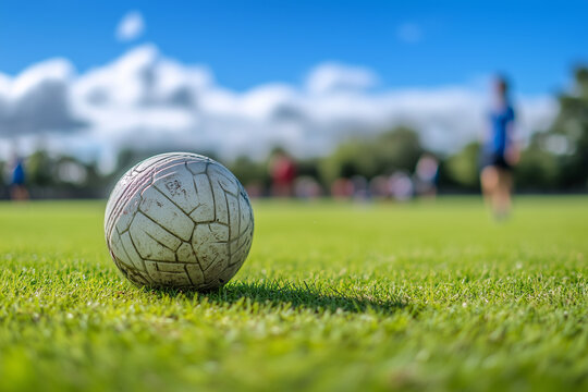 Hurling Ball on GAA Field During Community Match - Irish Sports Fun
