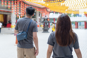 June 2024. A Chinese Malaysian couple in their 30s spends time at a famous Chinese temple popular with tourists in Kuala Lumpur, Malaysia.