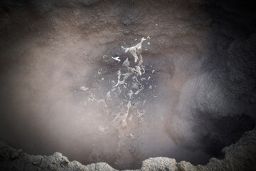 Acid water turns rock into a boiling Mud Pool in Hverarönd / Hverir in Námafjall Geothermal Area,...